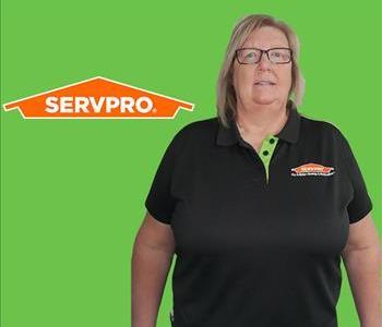 Woman in Front of SERVPRO Logo