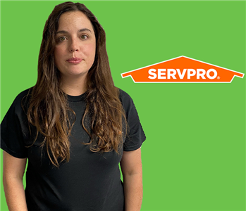 Women in front of SERVPRO Green and Logo Content Cleaner