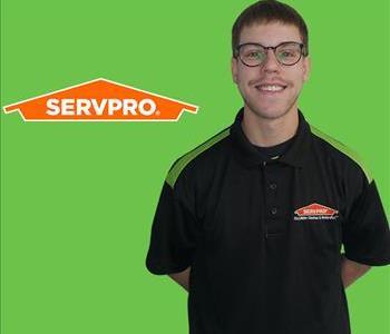 Man, Project Manager, in front of SERVPRO Logo on a green screen
